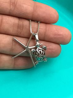 "Sterling Silver Filigree Turtle and Starfish Charm Necklace Great gift for beach lover. Metal: All components are made from solid .925 Sterling Silver Measurement: Turtle height is 25mm (0.98\") and 14mm (0.55\") wide ; Starfish height is 31mm (1.2\") and 21mm (0.83\") wide Choose Chain Length You can find other charm jewelry in my shop here https://www.etsy.com/shop/LinksAndStones?ref=seller-platform-mcnav&section_id=24389019 Please feel free to Convo me with any questions before purchasin Beach Jewelry With Star Charm Pendant, Silver Jewelry With Starfish Charm For The Beach, Starfish Charm Strand Jewelry Gift, Starfish Charm Strand Jewelry For Gift, Silver Starfish Jewelry For Vacation, Silver Starfish Jewelry For Beach, Beach Jewelry With Sterling Silver Star, Beach Jewelry In Sterling Silver With Star Shape, April Birthstone Necklace