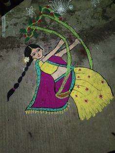 a painting on the ground depicting a woman dancing