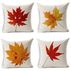 four pillows with different colored leaves on the front and back, each featuring an orange maple leaf