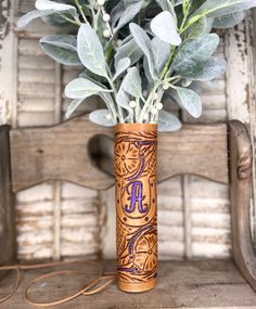 a vase with some flowers in it on a table