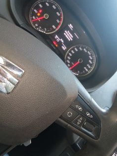 the interior of a car with gauges and dash lights