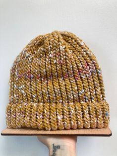 Warm up with this chunky cozy hand knit beanie. Beautiful golden yellow tweed with hints of color.  one size fits all, will stretch accordingly.  wool blend Hand Knitted Yellow Crochet Hat, Handmade Yellow Crochet Hat For Winter, Yellow Knitted Beanie For Winter, Yellow Crochet Hat For Winter, One Size, Hand Knitted Yellow Beanie Hat, Winter Yellow Crochet Hat, One Size, Yellow Knit Beanie Hat, Yellow Yarn Crochet Beanie Hat, Yellow Hand Knitted Beanie Crochet Hat