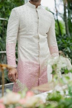 Beige and amaranth pink ombre sherwani with all-over bead embroidery. Comes with straight pants.
Components:2
Pattern:Embroidery
Type of Work:Beads and Thread
Neckline:Band
Sleeve Length:Full
Fabric:Twill Silk
Color:Pink,Beige
Other Details:
Closure: Concealed button front
Note: Shoes and drape shown in the image are not for sale
Occasion:Wedding - Aza Fashions Pink Long Sleeve Sherwani With Dabka Work, Pink Bandhgala With Dabka Work In Traditional Drape, Pink Sherwani With Dabka Work, Fitted Pink Sherwani With Dabka Work, Pink Fitted Sherwani With Dabka Work, Pink Bandhgala With Dabka Work For Reception, Fitted Pink Bandhgala With Dabka Work, Pink Fitted Bandhgala With Dabka Work, Pink Sherwani For Diwali Ceremonial Occasion