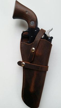 a brown leather sheath with a knife in it