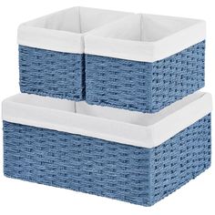 two blue wicker baskets with white liners