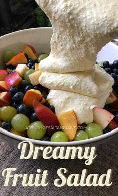 a bowl filled with fruit and whipped cream