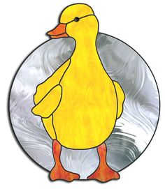 a yellow duck is standing in front of a circular glass plate with silver swirls