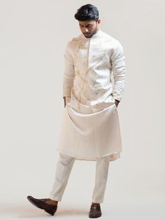 This Cream Paradise Nehru Jacket will instantly give an elegant look. This Cream Nehru Jacket features in linen satin fabric with Khalisa stitch detail, frenchknots, challa-zardosi, chintz motif embroidery, invisible front button placket, and a mandarin collar. An ideal outfit for traditional occasions, and special events.

Size Chart For Men





	
	
					Men's Size Chart
		

		
		
						
				Size Chart For Men
				Custom Size Measurement Guide
			
			
				
				
				Custom Size Measurement Guid Linen For Men, Satin Kurta, Nehru Jacket For Men, Motif Embroidery, Pyjama Pants, Nehru Jacket, Beige Jacket, Nehru Jackets, Satin Pants