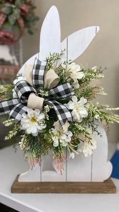 a bouquet of flowers sitting on top of a white table