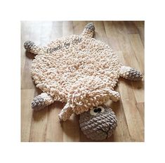 a stuffed animal laying on top of a wooden floor