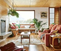 a living room filled with furniture and a fire place