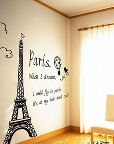 a room with a wall decal that says paris when i dream, i would fit to move it's at my back end