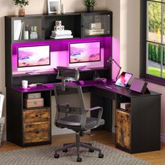 a computer desk with two monitors on it