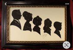 the silhouettes of four people are framed in a black frame