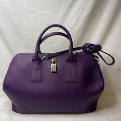 Gold Tone Hardware, Zippers Are Working, Comes With Shoulder Strap, Clean Inside, 7.5 Inches Tall, 13 Inches Long, 6 Inches Wide, Euc 4 Inch To 17 Inch Drop Elegant Purple Bag With Zipper Closure, Elegant Purple Bags With Zipper Closure, Elegant Purple Shoulder Bag With Zipper, Elegant Purple Shoulder Bag With Palladium Hardware, Chic Purple Satchel For Formal Occasions, Chic Purple Bag With Silver-tone Hardware, Elegant Purple Satchel With Adjustable Strap, Formal Purple Satchel With Detachable Strap, Purple Shoulder Bag