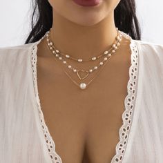 This necklace shines with pearl accents for a dash of shimmering style. Short chains: 13.7" L with 2.7" extender Longest Chain : 17.7" L with 2.7" extender Lobster claw clasp 18k gold-plated copper / pearl Pearl Love, Pearl Chain Necklace, Hollow Heart, Choker Necklace Set, Gold Necklace Set, Enamel Bracelet, Chain Choker Necklace, Pearl Pendant Necklace, Pearl Chain