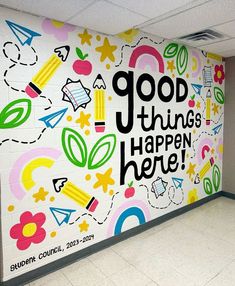 a large mural on the side of a building that says good things happen here, student council, 2012 - 2009