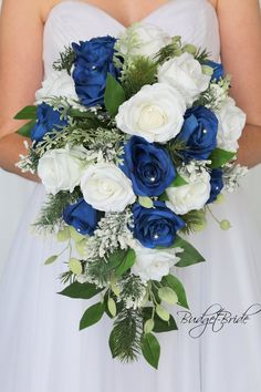 a bride holding a blue and white bouquet