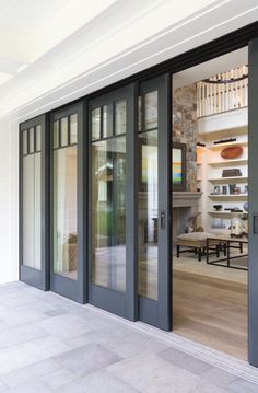 an open glass door leading to a living room