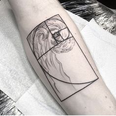 a man's arm with a geometric tattoo on it