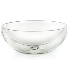 a glass bowl sitting on top of a white table