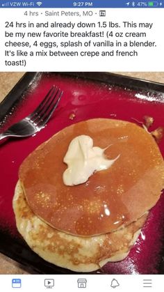 a red plate topped with pancakes covered in butter