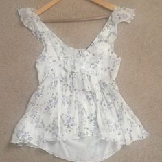 Zara Romantic Frill Top With Cut Out At The Back. It’s Beautiful And Never Worn. In Excellent Condition. Chic Flowy Top For Garden Party, Feminine Flowy Tops For Garden Party, Flowy Feminine Tops For Garden Party, V-neck Ruffle Top For Garden Party, Feminine V-neck Blouse For Garden Party, Elegant Spring Tops For Garden Party, White Feminine Blouse For Garden Party, Feminine White Blouse For Garden Party, White Ruffled Blouse For Garden Party