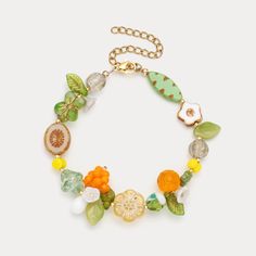 DETAILS Plating: 18K Gold Materials: 18K Gold on Brass, Crystal, Coloured Glaze Measurements: Length: 7.09 "(18cm) + Extender: 2.76"(7cm) Weight: 14.7 g Green Beaded Bracelets For Beach In Spring, Green Flower Beaded Bracelets For Beach, Spring Green Bracelets With Colorful Beads, Summer Gift Beaded Bracelets With Large Beads, Summer Gift Large Beaded Bracelets, Summer Beaded Bracelets With Large Beads As A Gift, Green Bohemian Beaded Bracelets For Spring, Summer Flower Charm Bracelet, Bohemian Green Bracelets With Flower Charm