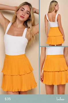 Celebrate the spring season with a cute new look like the Lulus Perfect Delight Light Orange Pleated Tiered Mini Skirt! Lightweight, cotton-blend pleated woven fabric shapes this totally adorable skirt that features a high, banded waist and a tiered, A-line silhouette that finishes at a flirty mini hem. Hidden side zipper/clasp. Fit: This garment fits true to size. Length: Mid-thigh. Size medium measures 16" from waist to hem. Waist: Fitted - very fitted at natural waist. Hip: Loosely Fitted. Fa Cute Cotton Pleated Skirt, Fitted Summer Skort With Pleated Skirt, Pleated Mini Skirt For Brunch, Pleated Tiered Skirt For Brunch, Tiered Pleated Skirt For Brunch, Cute Pleated Mini Skirt For Spring, Pleated Tennis Skirt For Day Out, Cute Pleated Skort For Summer, Pleated Skirted Skort For Day Out