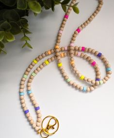 Features - Colorful Heishi Beads Acrylic Letters 6mm Polished Wood Beads Gold Hardware Matching Tassel Finished with a Knot (if a breakaway is desired, please add the breakaway listing to your purchase) Length measurements are WITHOUT HARDWARE - HARDWARE ADDS ABOUT 1.5 INCHES AND NAME DISCS ADD 1.7-2 INCHES EXTRA. -DISC SOLD SEPERATELY  -Want to add a name disc? https://www.etsy.com/listing/1269719778/ -Want to add a breakaway clasp? https://www.etsy.com/listing/1363154316/ -Want to add an ID Po Beaded Lanyards Diy, Teacher Lanyard Beaded, Bead Lanyard, Diy Lanyard, Lanyard Teacher, Polished Wood, Beaded Lanyard, Teacher Lanyard, Acrylic Letters