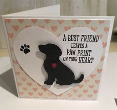 a card with a black dog and heart on it that says, a best friend leaves a paw print on your heart