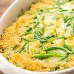 a casserole dish filled with green beans and cheese