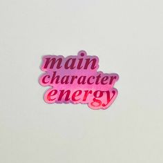 a sticker that says main character energy in pink lettering on a white background with the words main character energy