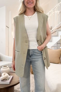 The City Girl Tailored Oversized Vest is a basic piece that can be styled and layered in so many ways! Featuring a v neckline, lining throughout, welt pockets, light olive color, tailored look, buttons and an oversized fit. Style this tailored vest with trousers for work or with jeans and a tank for a casual lunch! Details & Sizing V neckline Lining throughout Welt pockets Light olive color Tailored look Buttons Oversized fit Gabriella is wearing a size S Fabric 95% Polyester 5% Spandex 100% Pol Tailored Vest, Oversized Vest, Pocket Light, Sock Shop, Olive Color, City Girl, Sweater Set, V Neckline, 21 Days