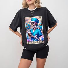 The 12 Hour Shift Tarot Card T-Shirt, Funny Nurse Tarot Card Humor, Trendy Women Shirt, Skull Vintage Shirt for Registered Nurse Gift 🌸 Soft & Lightweight Material - Graphic tees for women are made from a soft, lightweight, and stretchy fabric that provides a familiar and comfortable feel. You'll love wearing it all day long. 🌸 GREAT GIFT:  Good choice as a gift for your mom, sister, your wife or anyone you want to send a gift. The print is a great inspirational message for anti-bullying, posi 12 Hour Shift, Graphic Tees For Women, Reading Humor, Trendy Mom, Dirty Martini, Gifts For Your Mom, Nurse Humor, Tees For Women, Women Shirt