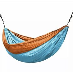 an orange and blue hammock hanging in the air