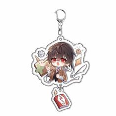 a key chain with an anime character holding a book and a pencil in it's hand