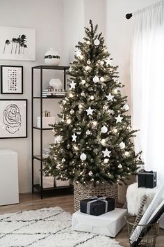 a white christmas tree in a living room