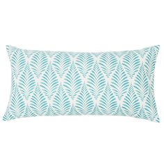 a blue and white pillow with an intricate design on the front, featuring large leaves