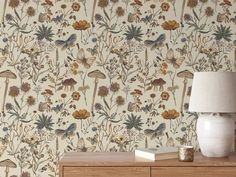 the wallpaper is very colorful and has many different flowers on it, as well as mushrooms