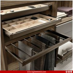 an open drawer in a closet with folded towels