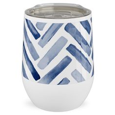 a white and blue cup with an abstract design