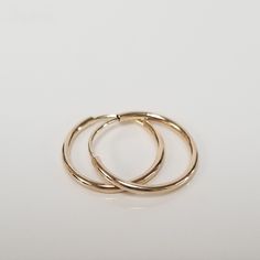 three gold rings sitting on top of each other