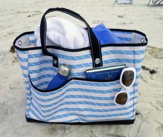 This large beach bag tote with deep outside pockets and lots of room for towels is a favorite of ours because it's lightweight and water resistant so you can wipe off the sand with water. #beachbag Cute Beach Bags, Clear Beach Bag, Personalized Shopping Bags, Best Beach Bag, Large Beach Bag, Boat Bag, Sail Bag, Waterproof Beach Bag, Perfect Beach Bag