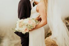 a bride and groom standing next to each other