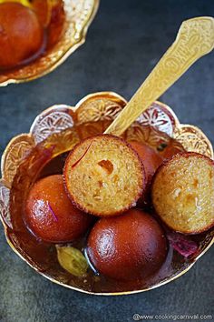 two bowls filled with food on top of a table