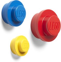 three different colored knobs with the word lego written on them in red, blue, and yellow