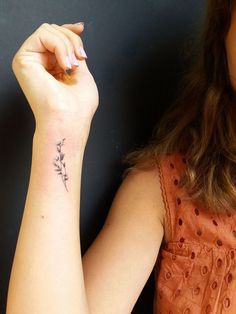 a woman with a tattoo on her arm and the words, 100 ideas about girl flower tattoos