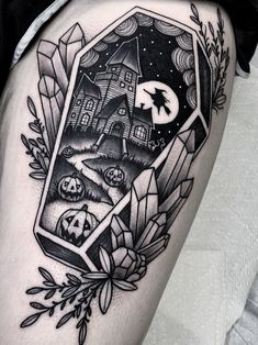 a black and white tattoo with an image of a house