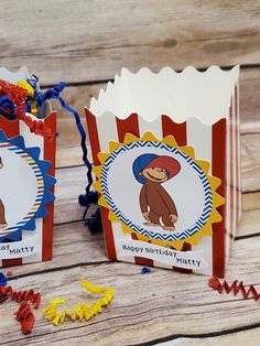 two circus themed birthday bags with tags on them